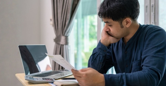 Men stress about a lot of credit card debt and bills
